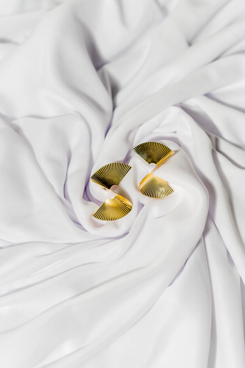 Gold plated statement fan earrings